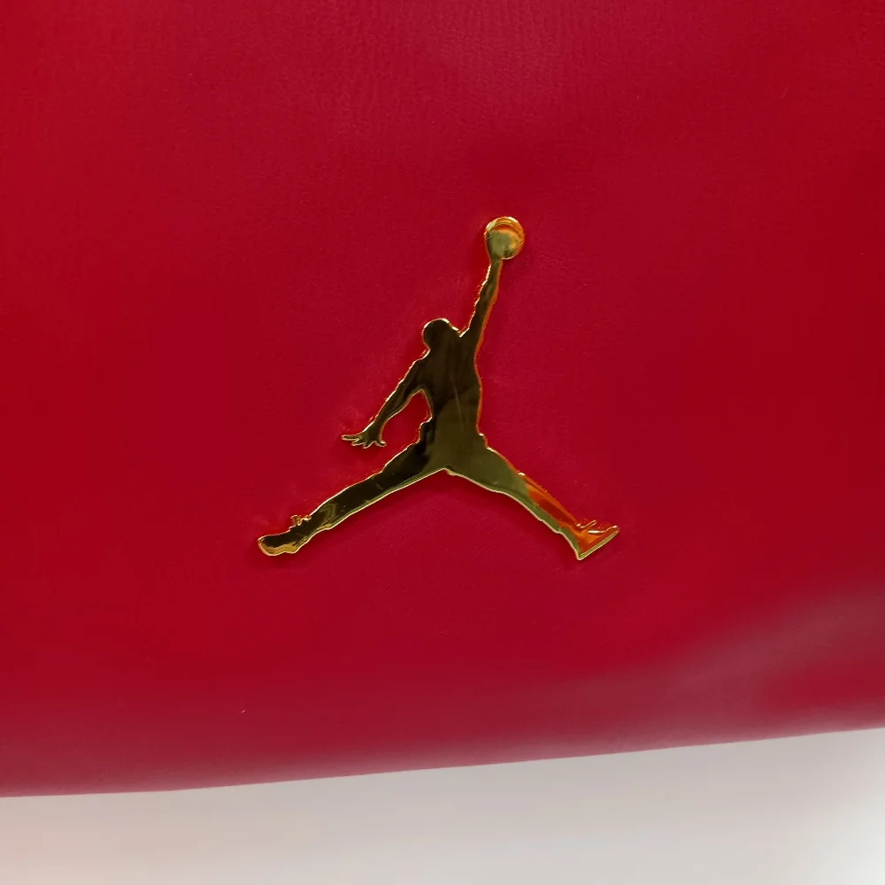 JORDAN Red Faux Leather Drawstring Backpack with Gold Jumpman